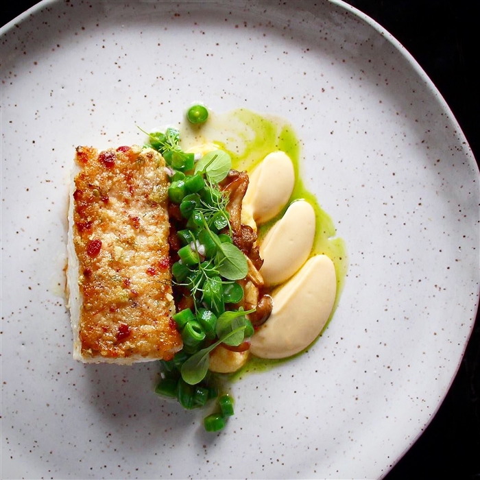 Halibut poached in sumac oil then crusted with pumpkin seeds and pancetta fat, smoked rutabaga